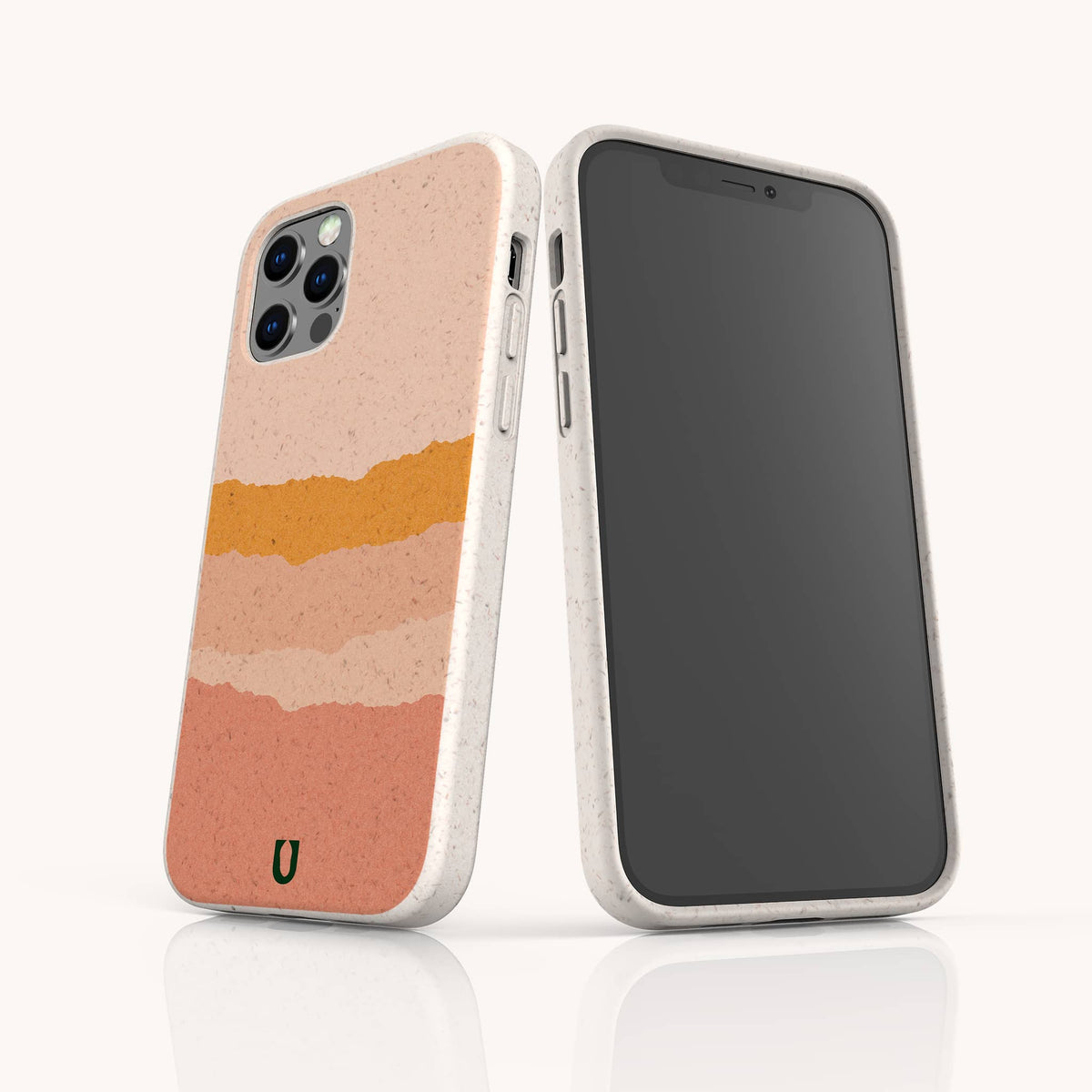 Two smartphones in speckled, off-white Valleys Eco-Friendly Phone Cases; one case features abstract horizontal stripes in peach, pink, and gold tones. The eco-friendly Valleys cases are displayed on a white reflective surface against a light background.