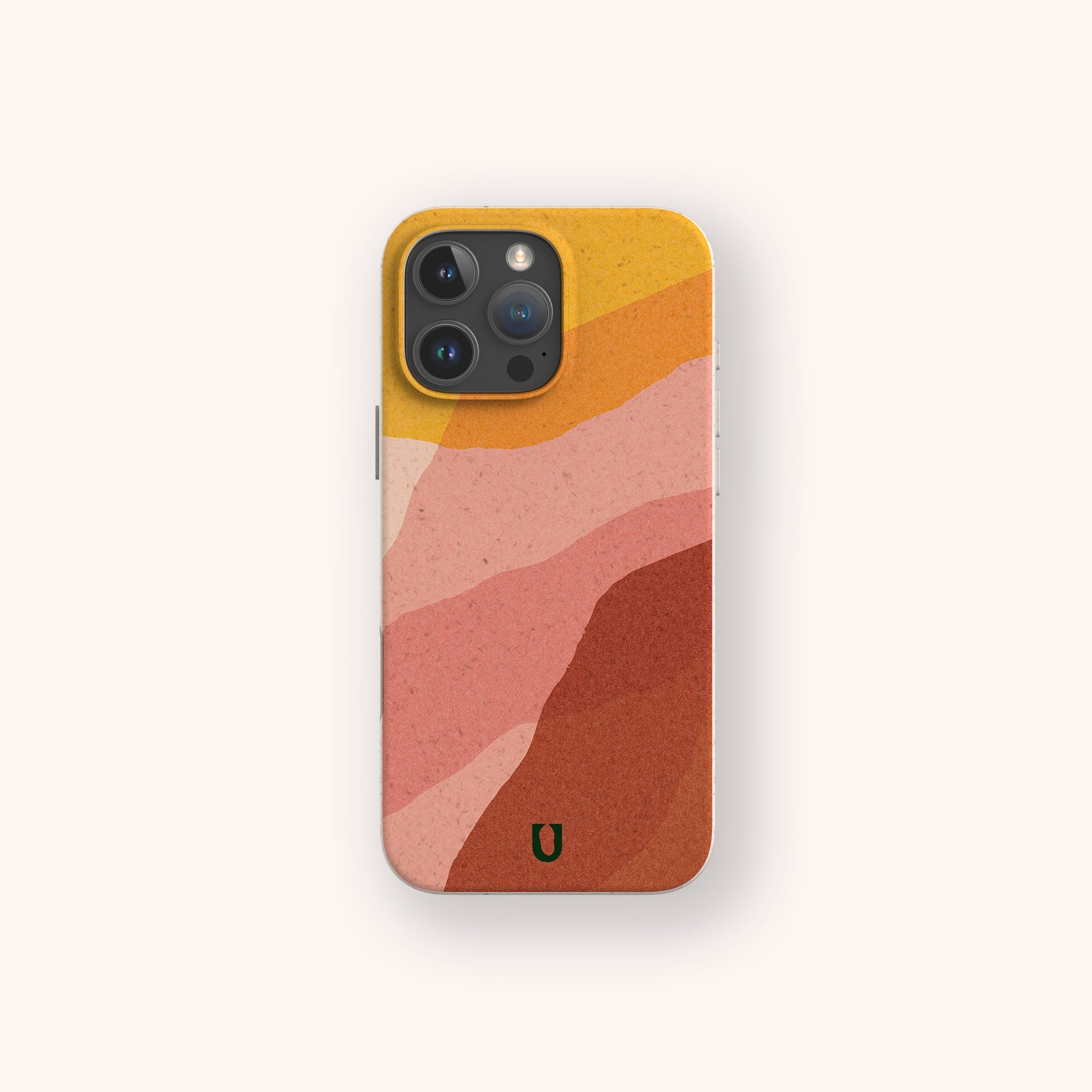 The Cliffs Eco-Friendly Phone Case features an abstract wavy design in yellow, pink, peach, and rust with a green horseshoe symbol near the bottom. Compatible with iPhone and Samsung Galaxy models.