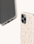Two Pink Wild Flowers Eco-Friendly Phone Cases for a smartphone, one displaying the front and the other showcasing the back with a delicate floral pattern in soft pink tones. This eco-friendly phone case combines stylish design with sustainability, making it an ideal choice for those who appreciate both aesthetics and environmentally conscious products.