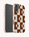 Phone case with brown and white checkered pattern on a white background
