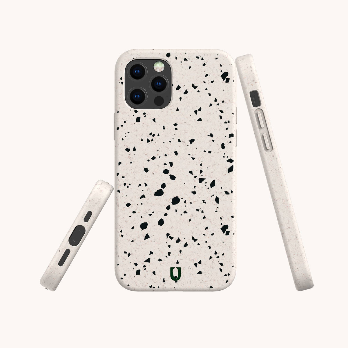 Three views of a smartphone in the Black Terrazzo Eco-Friendly Phone Case, featuring a light beige, speckled terrazzo-style design with black and gray flecks. The images display the back, side, and bottom of the phone against a plain background. This stylish case is both compostable and eco-friendly, offering protection while supporting sustainability.