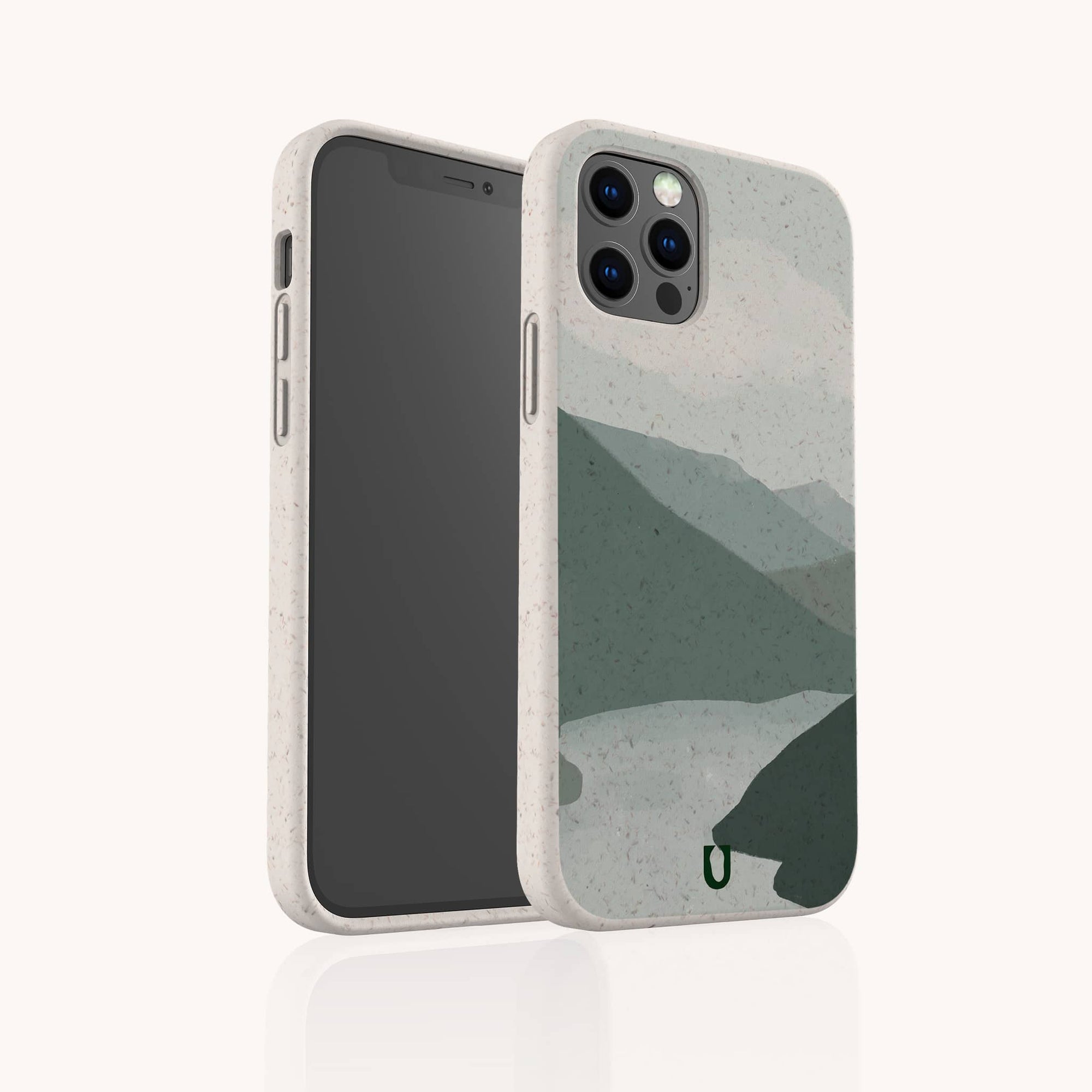 The Blue Watercolour Landscape Eco-Friendly Phone Case, shown from the back and side against a light background, features a beige-speckled biodegradable design with a minimalist blue watercolour mountain and lake scene.