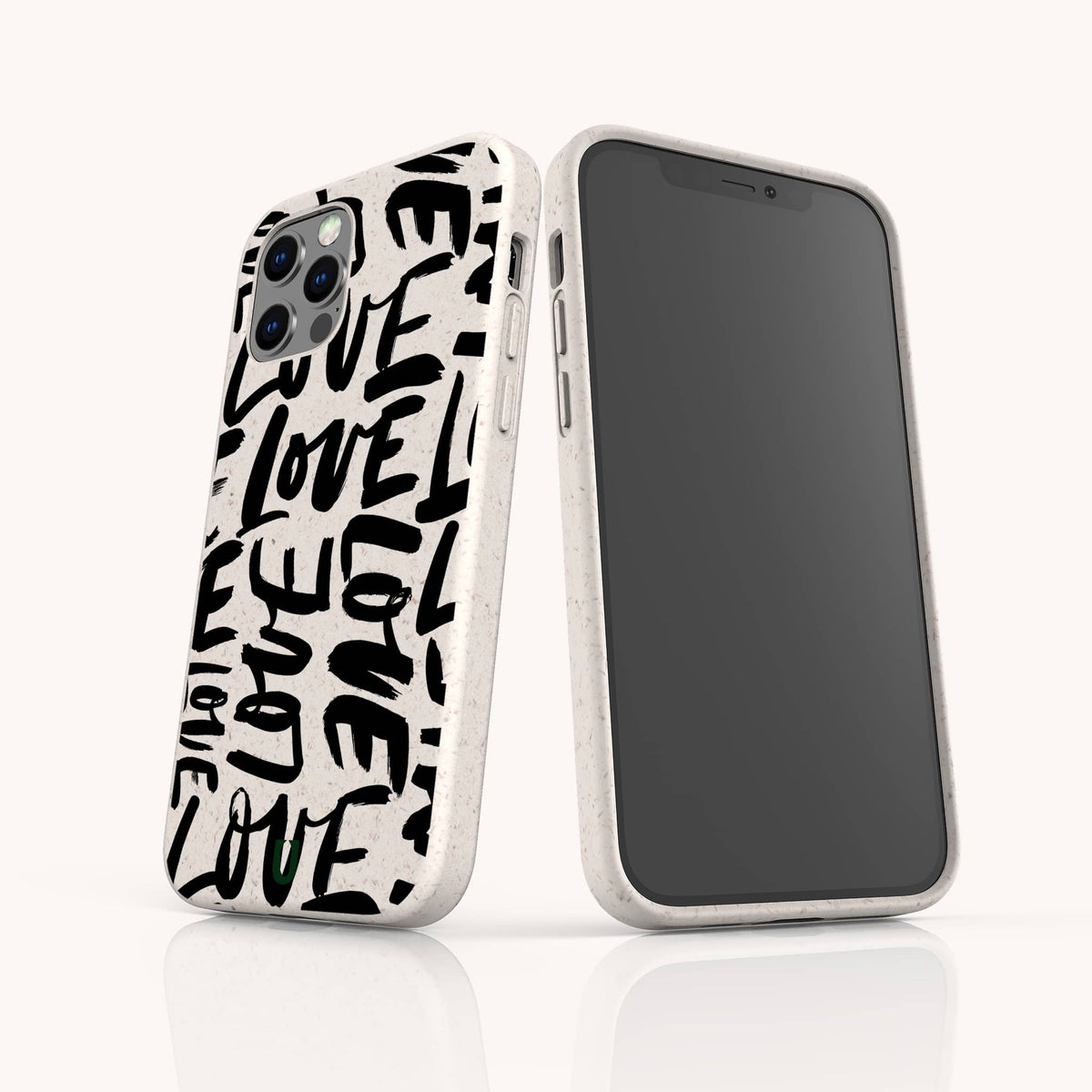 Two Love Words Eco-Friendly Biodegradable Phone Cases are displayed side by side; one highlights the back featuring the word LOVE printed repeatedly in bold black letters, while the other shows the front screen. These white cases have a speckled texture and are thoughtfully crafted to offer a stylish, planet-friendly accessory option.