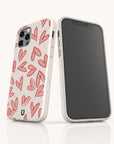 Presenting the Pink Hearts Eco-Friendly Biodegradable Phone Case—a sustainable accessory adorned with pink hand-drawn hearts on a crisp white background. One smartphone highlights the stylish back design, while the other reveals a blank, black screen—perfectly combining eco-consciousness and charming style for your daily essentials.