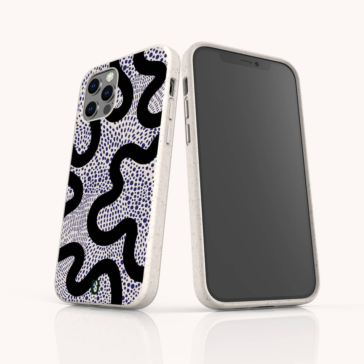 Two smartphones in white cases featuring black wavy and blue dotted patterns are displayed, one revealing the back design and the other showing a blank screen and side buttons, both standing upright on a white surface. Each phone is protected by the Speckled Swirl Eco-Friendly Biodegradable Phone Case, combining stylish design with sustainability.