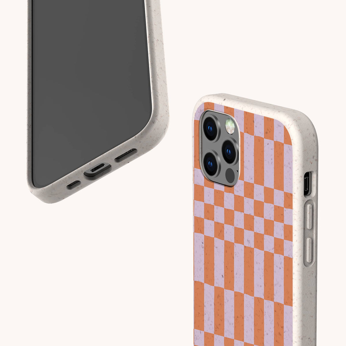 Two smartphones with speckled beige, eco-friendly biodegradable phone cases; one displays the front, while the other reveals the back featuring the bold Orange and Purple Checker Eco-Friendly Biodegradable Phone Case design.