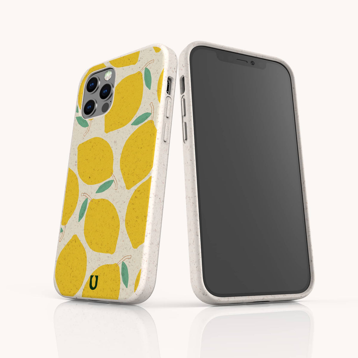 Two smartphones in white cases featuring the Lemons Eco-Friendly Phone Case design—a cheerful yellow lemon pattern with green leaves. One phone highlights the Lemons Eco-Friendly Phone Case, while the other displays its blank front screen. Both phones are standing upright on a white surface.
