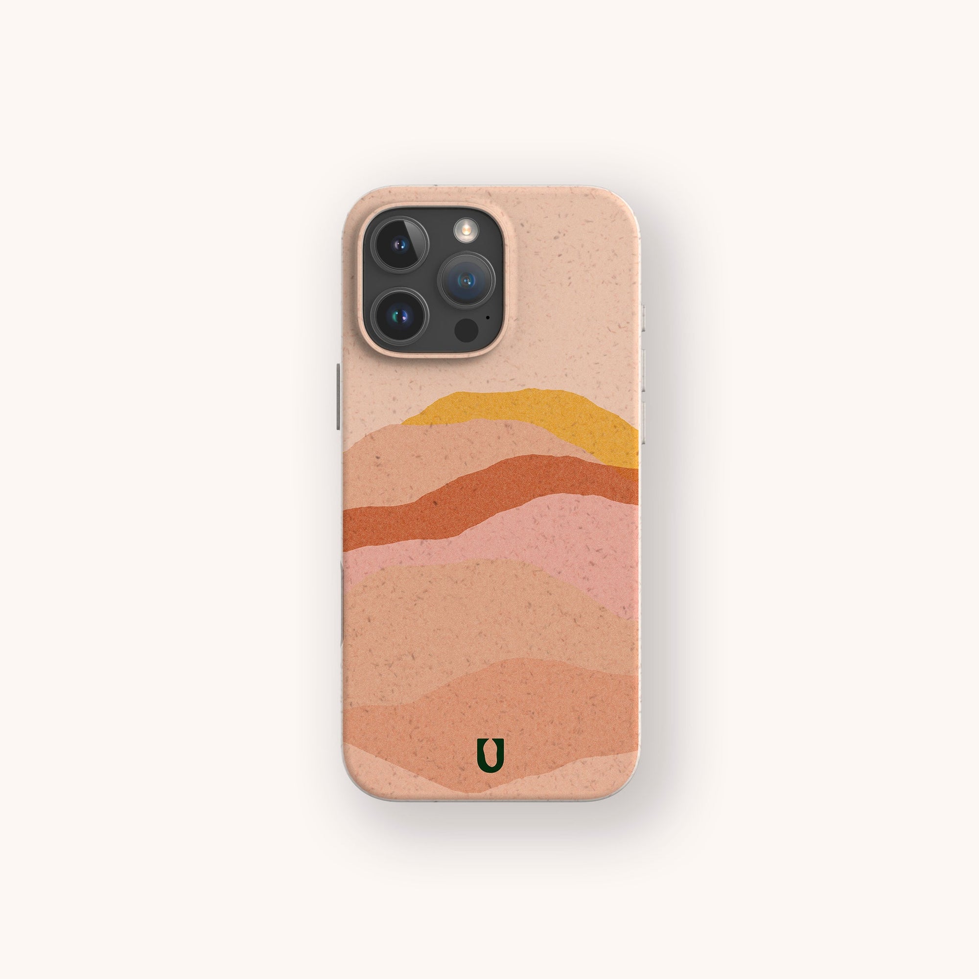 The Hills Eco-Friendly Phone Case in beige features abstract wavy layers in pink, orange, yellow, and tan, plus a green U-shaped logo near the bottom. Compatible with iPhone and Samsung Galaxy models.