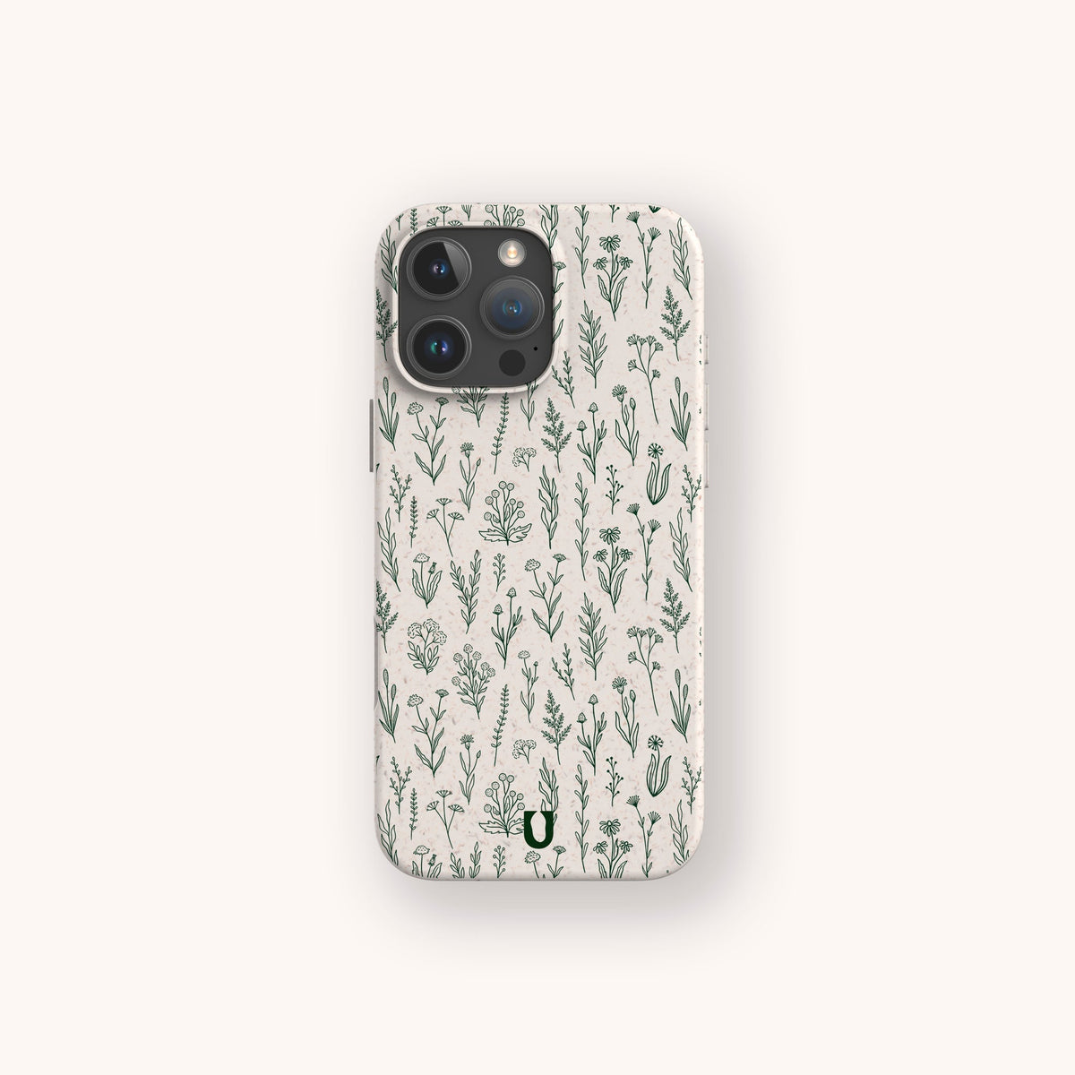 The Green Wild Flowers Eco-Friendly Phone Case is a cream-colored smartphone case adorned with a delicate green botanical pattern featuring various hand-drawn plants and flowers on a light, plain background.