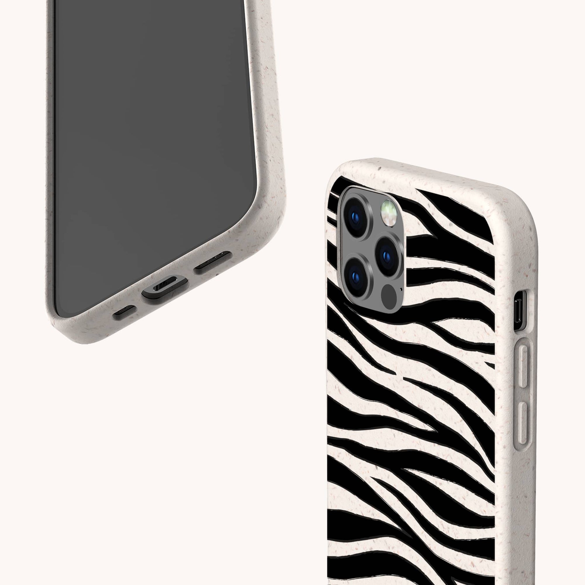 Two Zebra Eco-Friendly Phone Cases are displayed: one shows the front with a plain screen, and the other reveals a black-and-white zebra stripe pattern on the back. Both have beige edges, camera cutouts, and are eco-friendly.