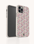 Two Coquette Roses Flowers Eco-Friendly Biodegradable Phone Cases, one displaying the front and the other the back, showcase a pastel pink floral pattern with green leaves on a white background. The phone inside has a black screen. This sustainable case design pairs elegant roses with biodegradable materials for stylish and eco-conscious protection.