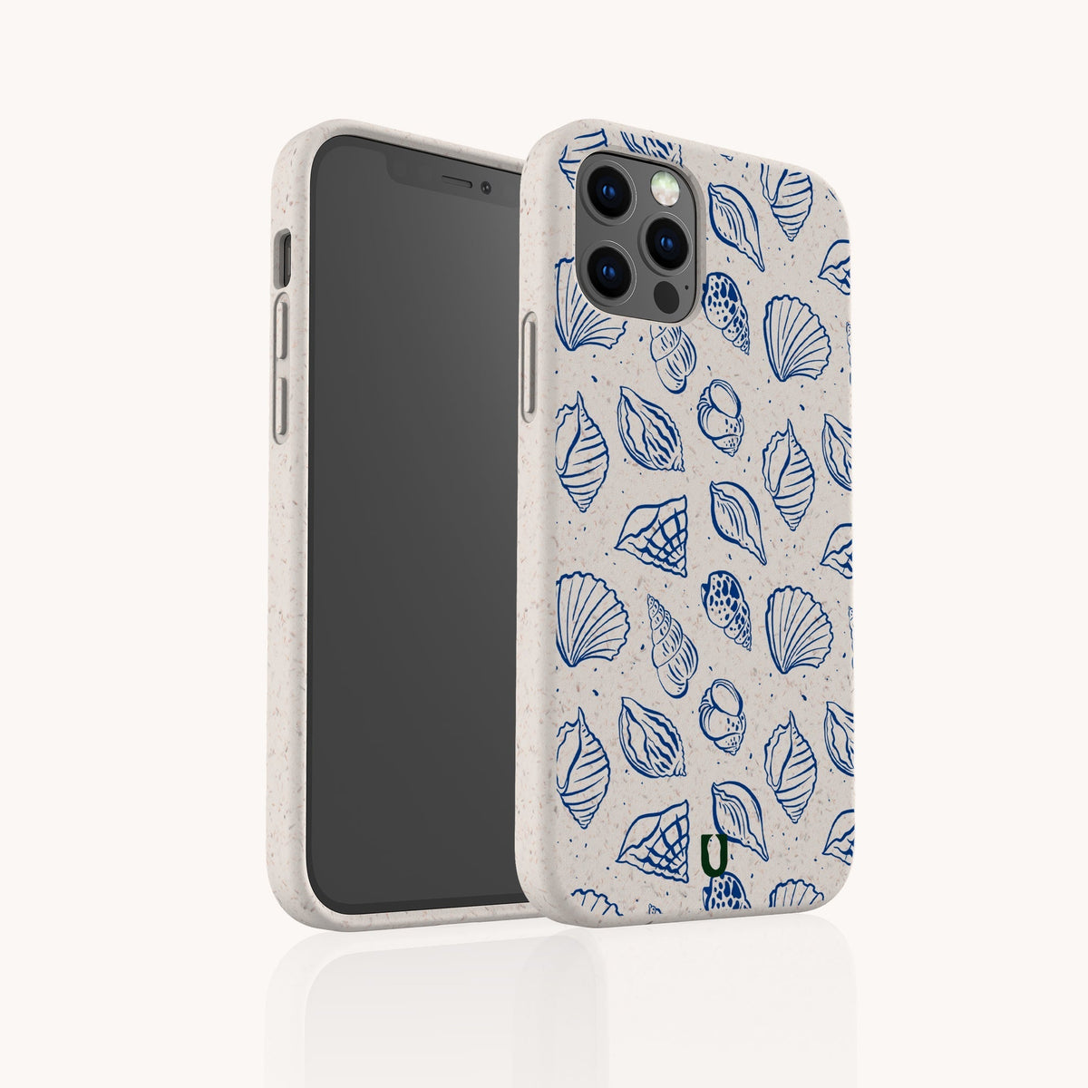 A smartphone with the Sea Shells Eco-Friendly Phone Case in beige, featuring blue seashell and sea life illustrations, stands upright to display both its front screen and the decorative back.
