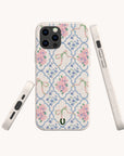 Pink Ribbons Eco-Friendly Biodegradable Phone Case shown from three angles against a plain background. The sustainable case features soft pink and blue flowers in a repeating pattern with green bows, combining eco-conscious materials with a charming pastel floral design.