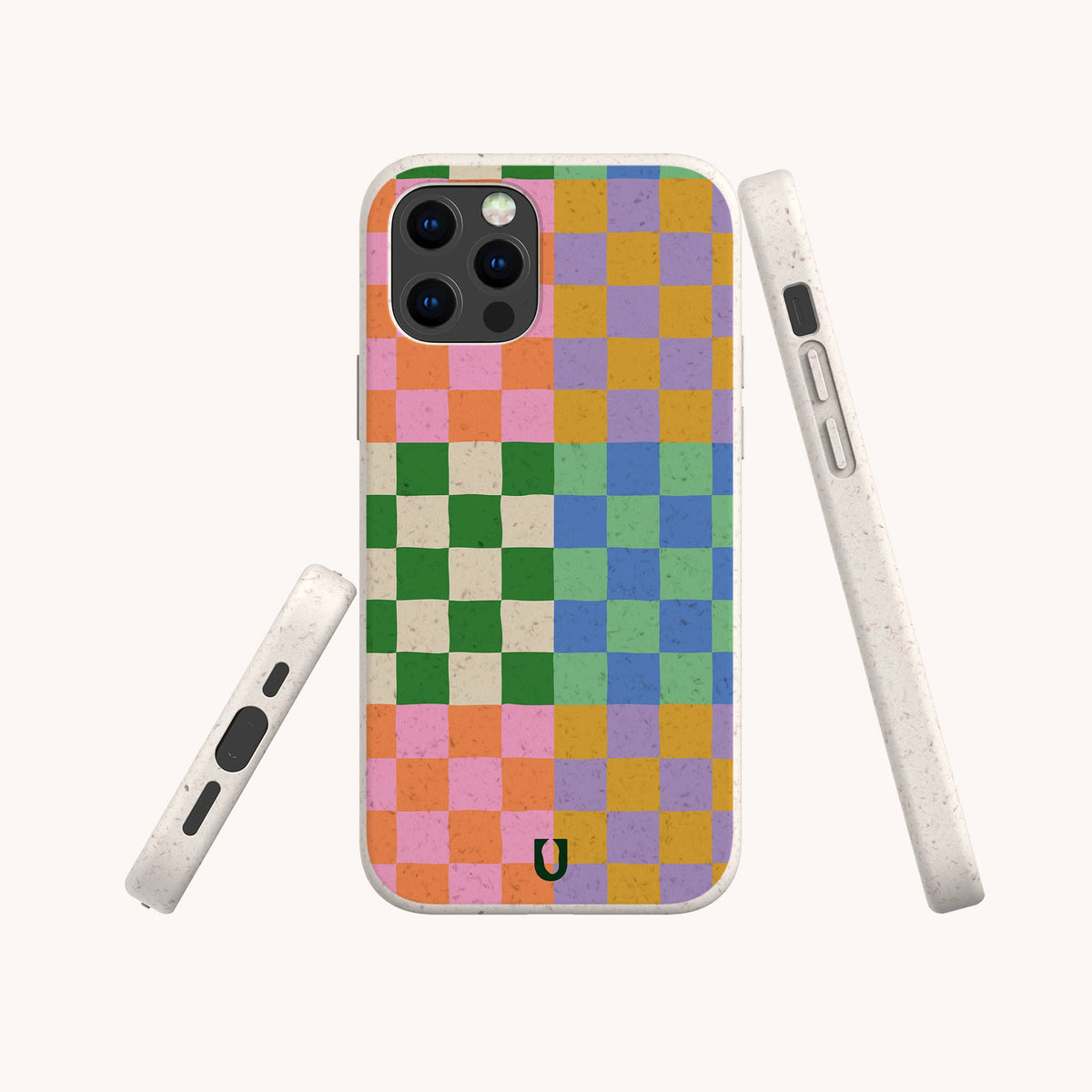A smartphone with a vibrant checkered case in pink, orange, green, blue, and purple is displayed from the back and sides against a light background. This striking Colour Checker Eco-Friendly Phone Case is available for both iPhone and Samsung Galaxy models.