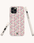 The Coquette Roses Flowers Eco-Friendly Biodegradable Phone Case, featuring a pink and purple floral pattern, is displayed from multiple angles against a plain background.