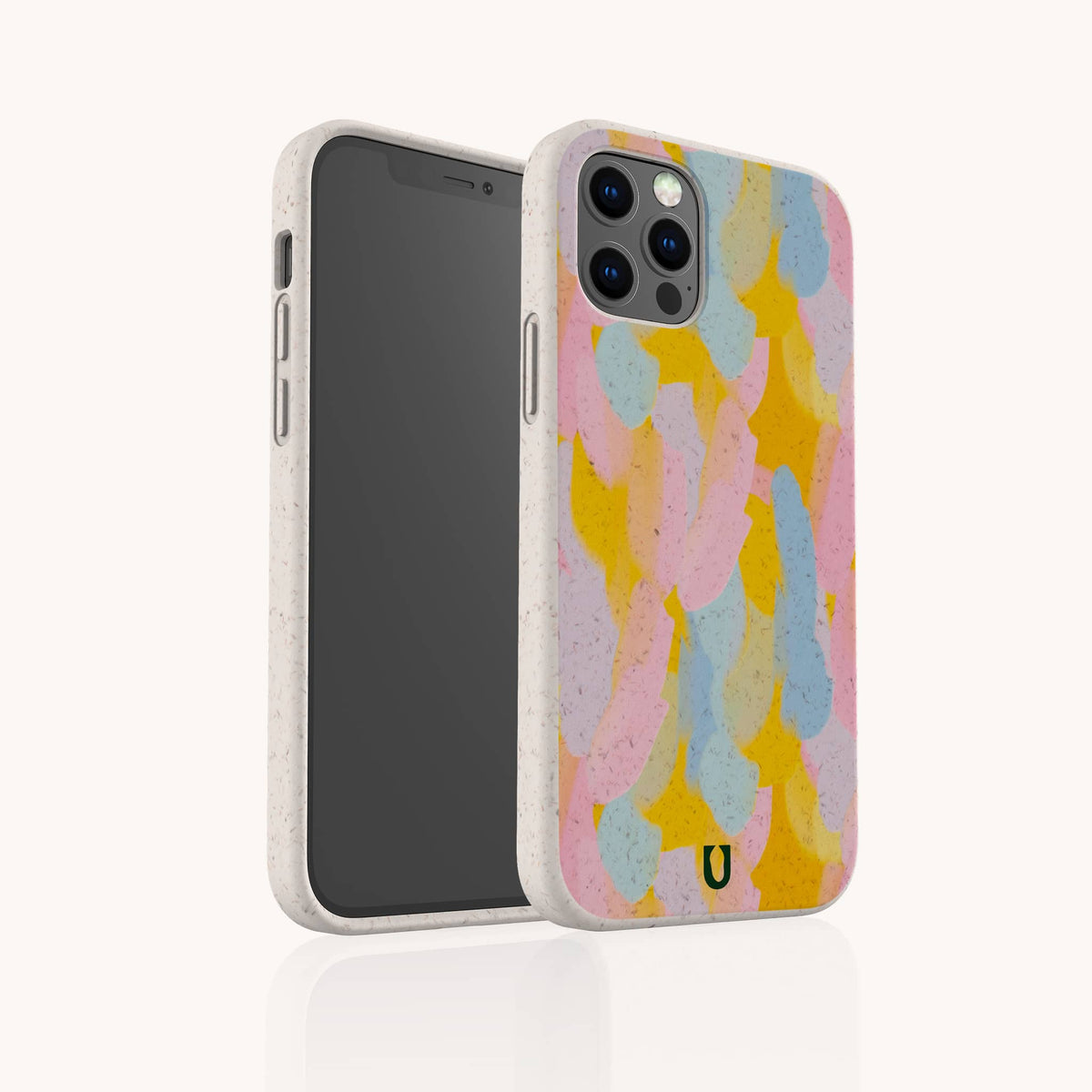 A smartphone with the Bubble Gum Eco-Friendly Phone Case, showcasing overlapping pastel brush strokes in pink, yellow, blue, and purple, stands upright against a plain white background.