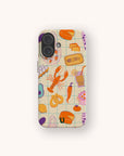 The Taste of Summer Eco-Friendly Biodegradable Phone Case features colorful illustrations of food items—such as lobster, pretzel, chili pepper, tomato, and canned fish—set against a beige grid background. This biodegradable phone case not only brings vibrant charm to your device but also helps reduce plastic waste.