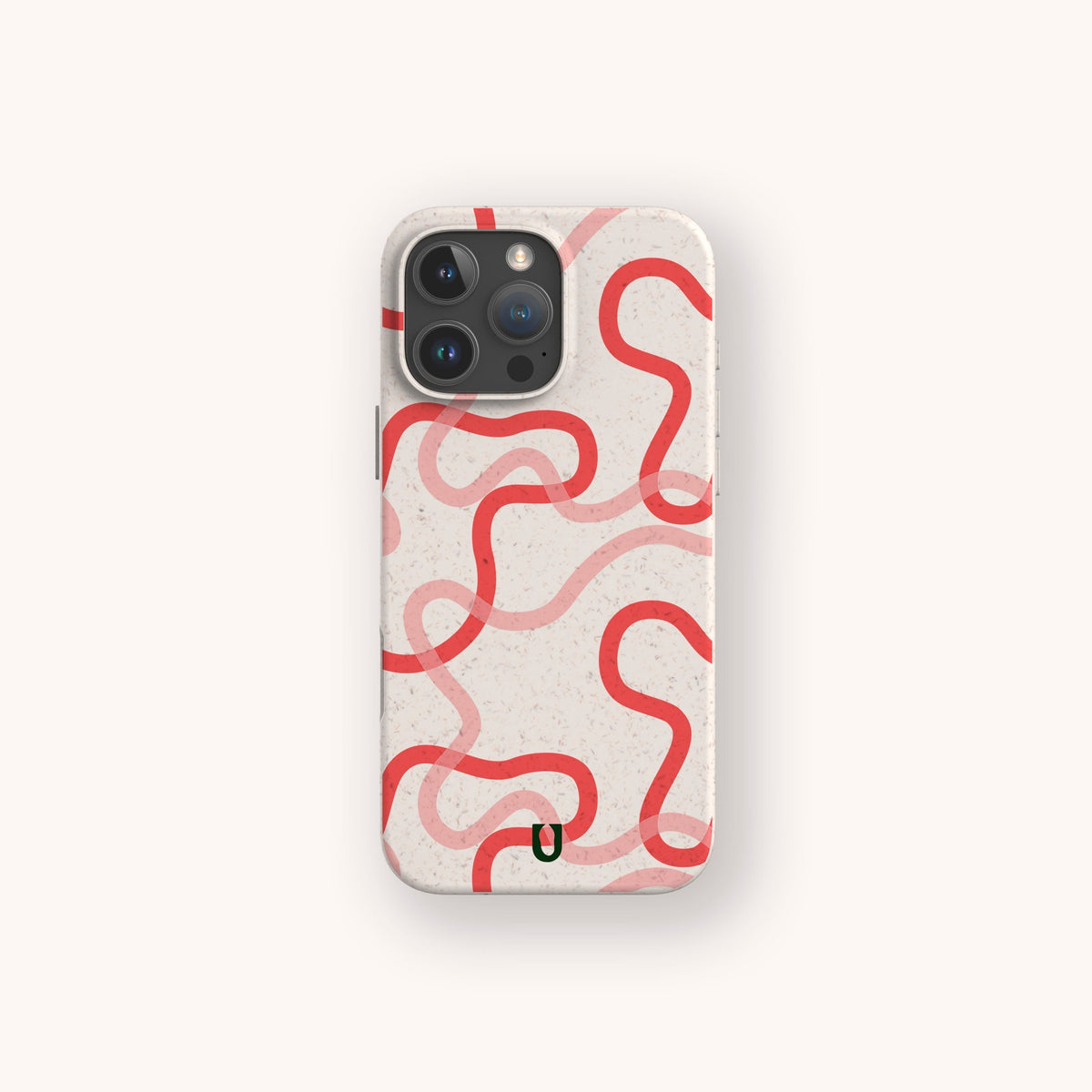 A Pink and Red Swirls Eco-Friendly Biodegradable Phone Case in white, displaying a pattern of wavy, interconnected red lines and a small black curved mark near the bottom, is shown on a smartphone set against an off-white background.
