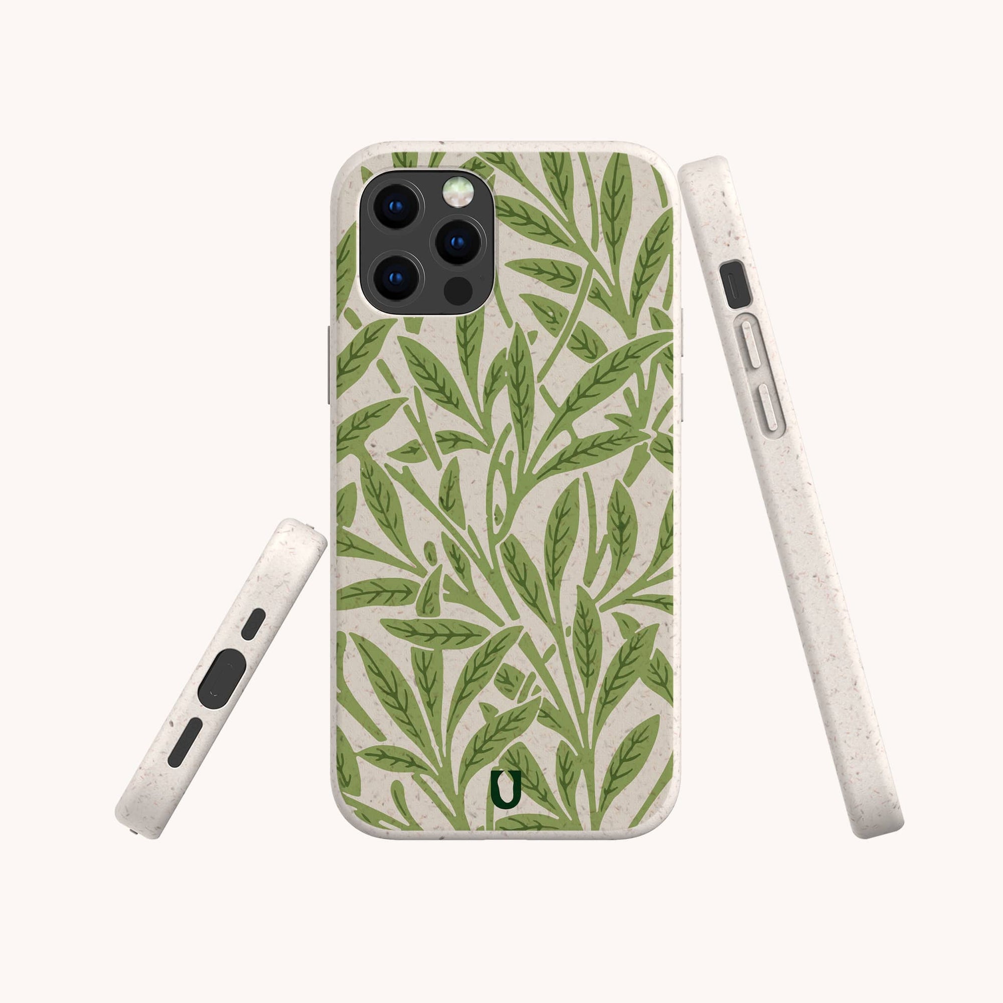 The Willow Eco-Friendly Phone Case features a green leafy plant pattern on beige, made from plant-based materials. Displayed in back, side, and angled views on an off-white surface. Fits iPhone and Samsung Galaxy models.