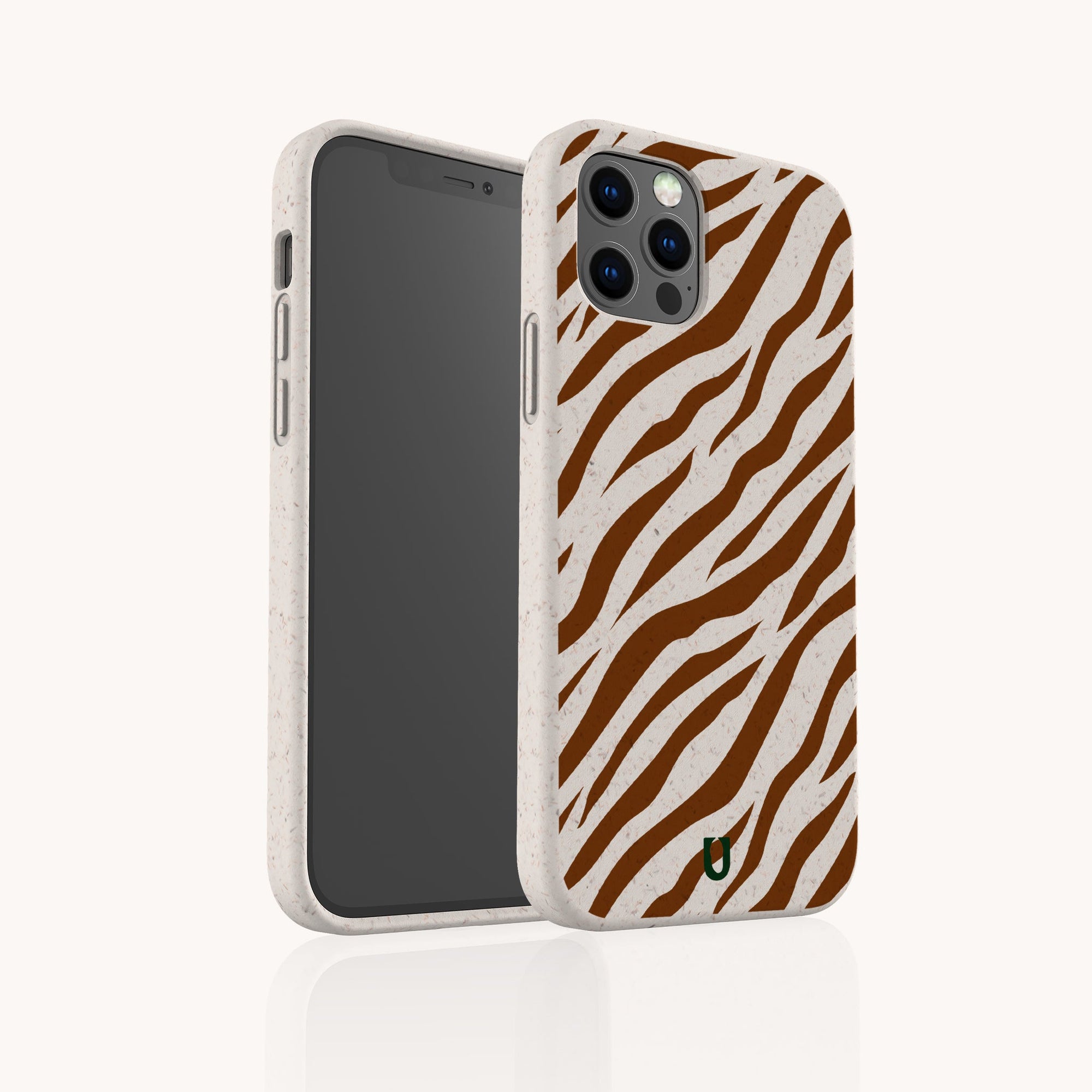 A smartphone in the Brown Zebra Eco-Friendly Phone Case, beige with brown zebra stripes and a green-black logo at the bottom right. Shown from front and back, it fits iPhone and Samsung Galaxy models.