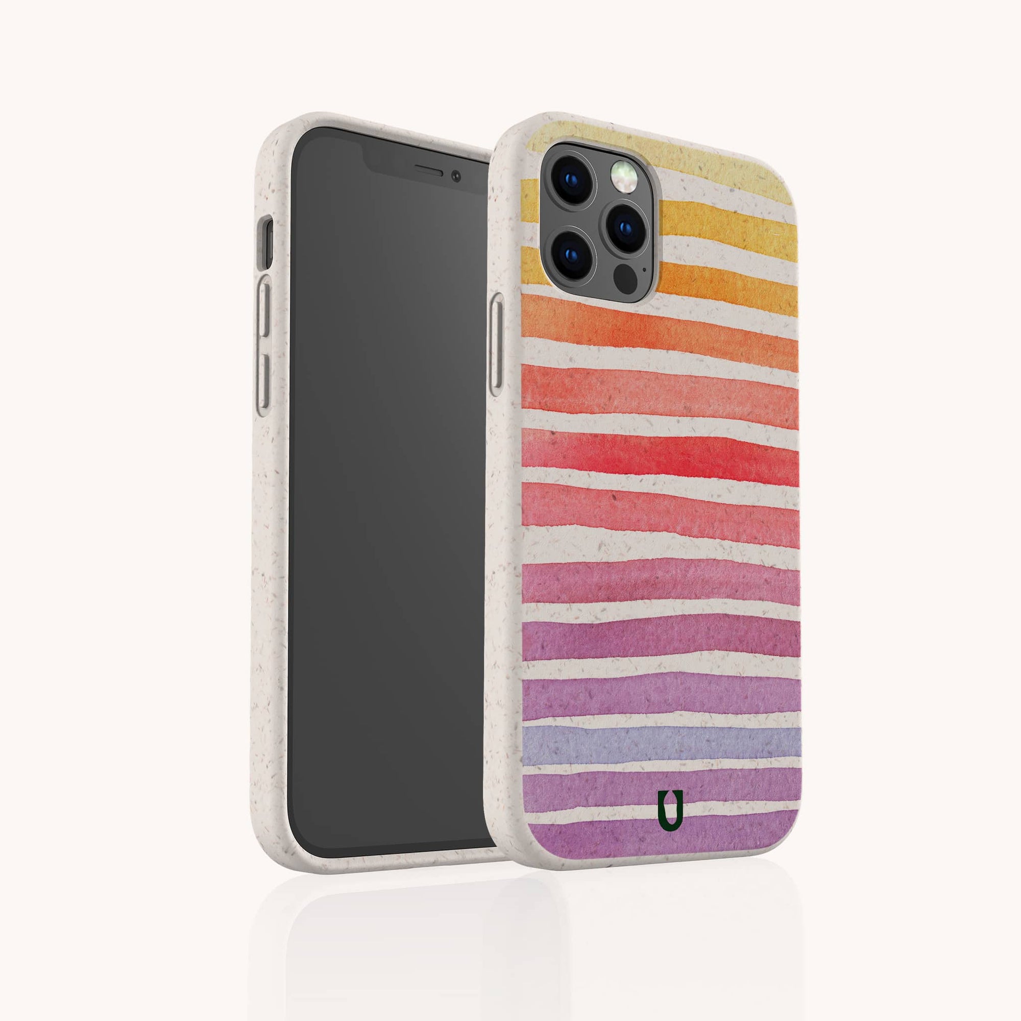 The Summer Rainbow Eco-Friendly Phone Case features colorful, uneven stripes in yellow, orange, red, pink, and purple on beige compostable material with a speckled texture and small black logo. Compatible with iPhone and Samsung.