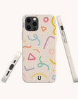 Three views of the Confetti Eco-Friendly Phone Case, featuring a speckled beige biodegradable material with colorful abstract shapes—squiggles, triangles, and curves in pink, blue, green, and yellow—displayed on a plain background. This eco-friendly case is compatible with both iPhone and Samsung devices.