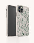 Two smartphones with matching beige cases adorned with a green wild flowers botanical pattern. One phone displays the screen while the other reveals the back and camera—showcasing the Green Wild Flowers Eco-Friendly Phone Case that blends style and sustainability.