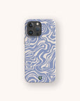 A Blue Marble Swirl Eco-Friendly Phone Case, featuring a blue and white wavy abstract pattern and a small green and black shield logo near the bottom, is centered on a light background.