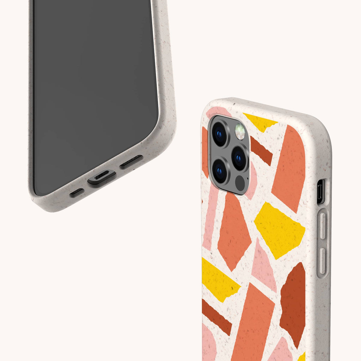 Two views of the Paper Scraps Eco-Friendly Biodegradable Phone Case, featuring a colorful abstract geometric pattern with pink, orange, yellow, and brown shapes. One view displays the smartphone’s front and bottom ports, while the other highlights the back design and camera.