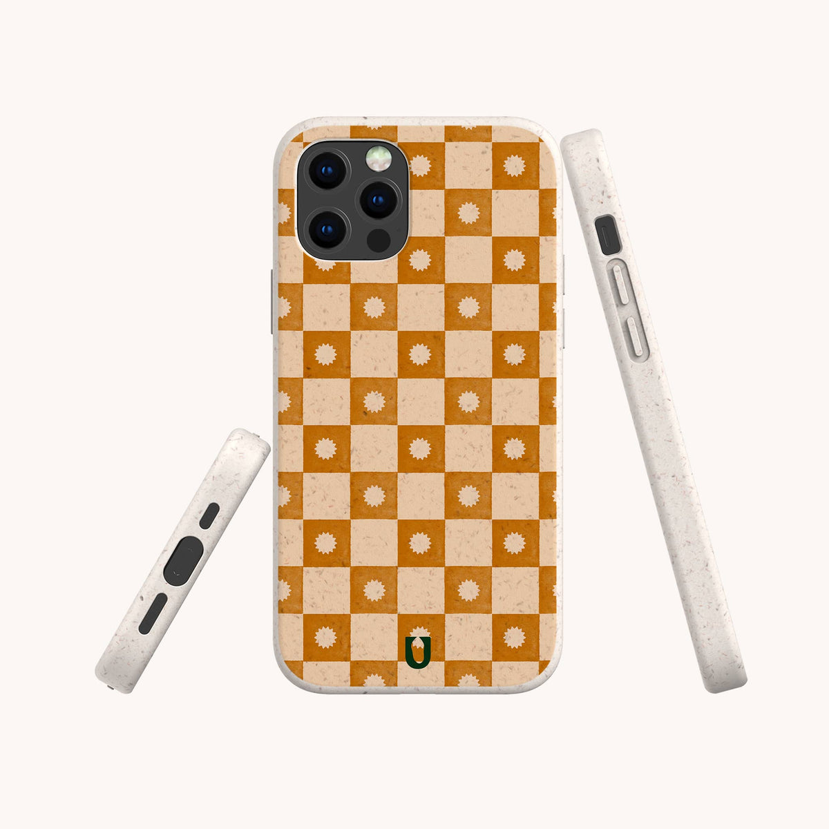 Three views of the Star Terracotta Checker Eco-Friendly Phone Case, showcasing an orange and beige checkerboard pattern adorned with small sun motifs. Crafted from eco-friendly, biodegradable materials, the case features a speckled off-white edge and a small penguin logo at the bottom center.