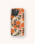 A smartphone with the Orange Blossom Eco-Friendly Phone Case, featuring an illustrated pattern of oranges, green leaves, and white orange blossoms on a beige background.