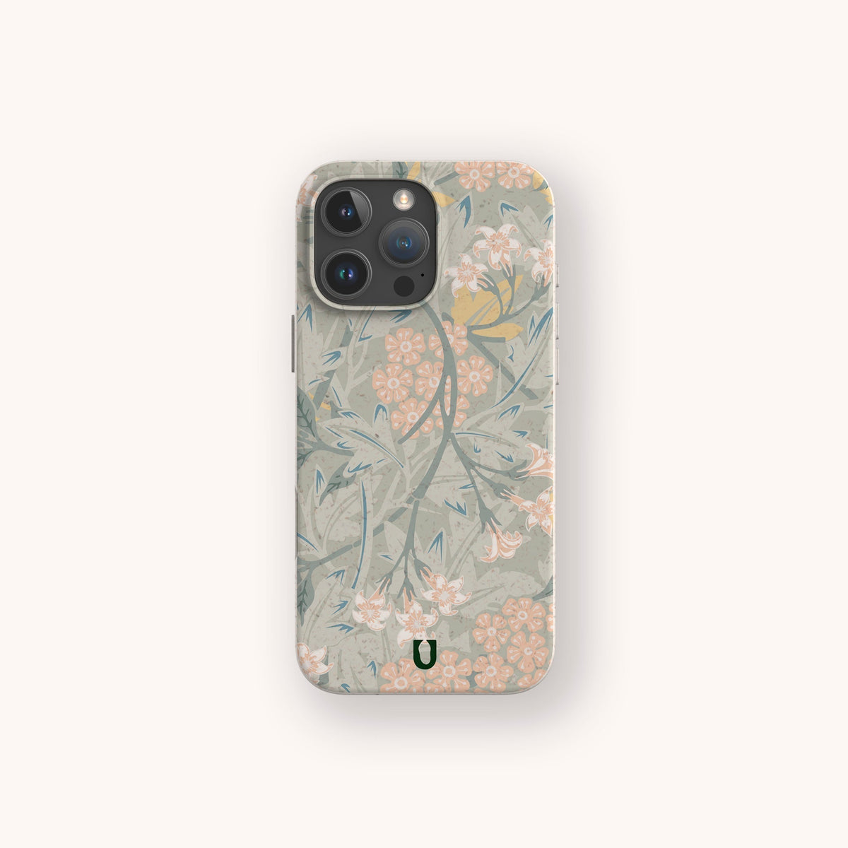 A smartphone with the Jasmine Eco-Friendly Phone Case, featuring a soft, pastel floral pattern in shades of green, beige, and pink with small flowers and leaves. This sustainable phone case also includes a small green U logo near the bottom.