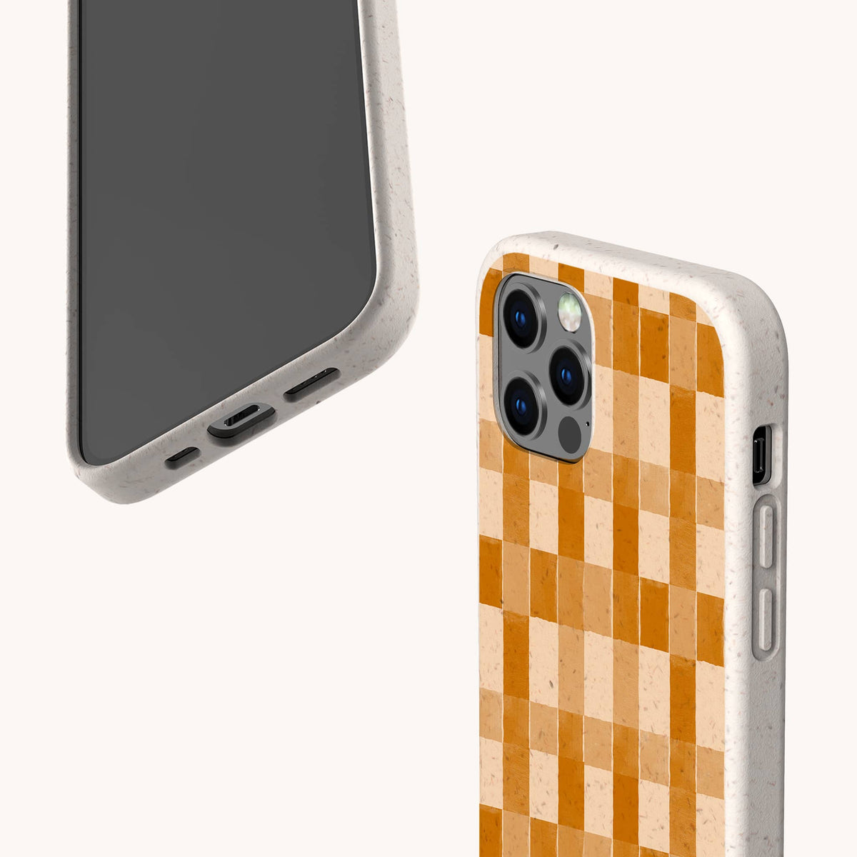 Two smartphones in biodegradable beige cases are showcased against a light background: one highlights the Brown Watercolour Checker Eco-Friendly Phone Case with its distinctive orange checkerboard pattern, while the other displays the phone’s plain front side.