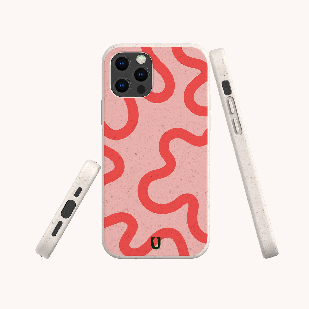 Three views of the Red and Pink Swirl Lines Eco-Friendly Phone Case on a smartphone, showcasing its light pink, speckled biodegradable material and bold wavy red lines. Compatible with both iPhone and Samsung devices, the case includes a subtle black horseshoe logo near the bottom.