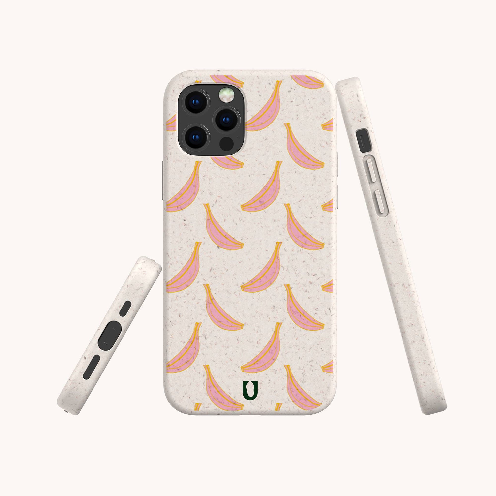 The Pink Bananas Eco-Friendly Phone Case features yellow bananas with pink outlines on a light speckled background, a green horseshoe logo at the bottom, and is compatible with iPhone and Samsung Galaxy models.