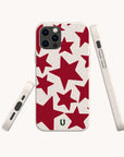 Three views of the Burgundy Stars Eco-Friendly Biodegradable Phone Case in white, featuring an array of red stars in various sizes. The case is displayed from the back, side, and bottom angles against a plain white background.