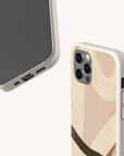 Two smartphones are pictured with the Beige Abstract Eco-Friendly Phone Case. One phone displays its screen and charging port, while the other showcases the case’s back, featuring curved brown, beige, and tan shapes. The light background highlights the case’s minimalist design and eco-friendly appeal.