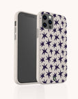 Wonky Stars Biodegradable Phone Case in beige, shown on a smartphone from both the front and back, features a scattered navy blue star pattern. The design highlights its sustainability and precise camera cutouts.