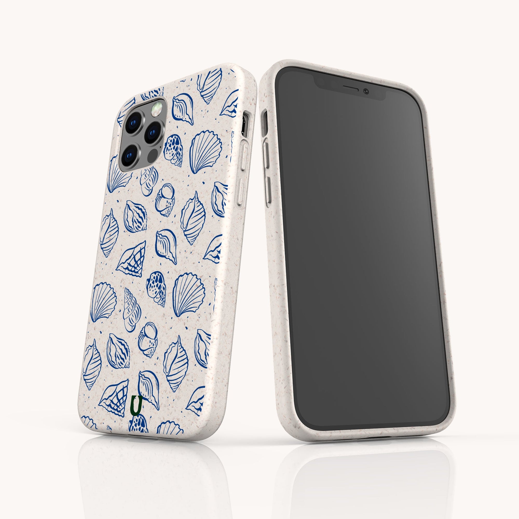 Two smartphones with the Sea Shells Eco-Friendly Phone Case, featuring blue seashell and leaf designs, showcase sustainable craftsmanship. One shows the back design; the other, compatible with iPhone and Samsung Galaxy, displays a blank black screen.