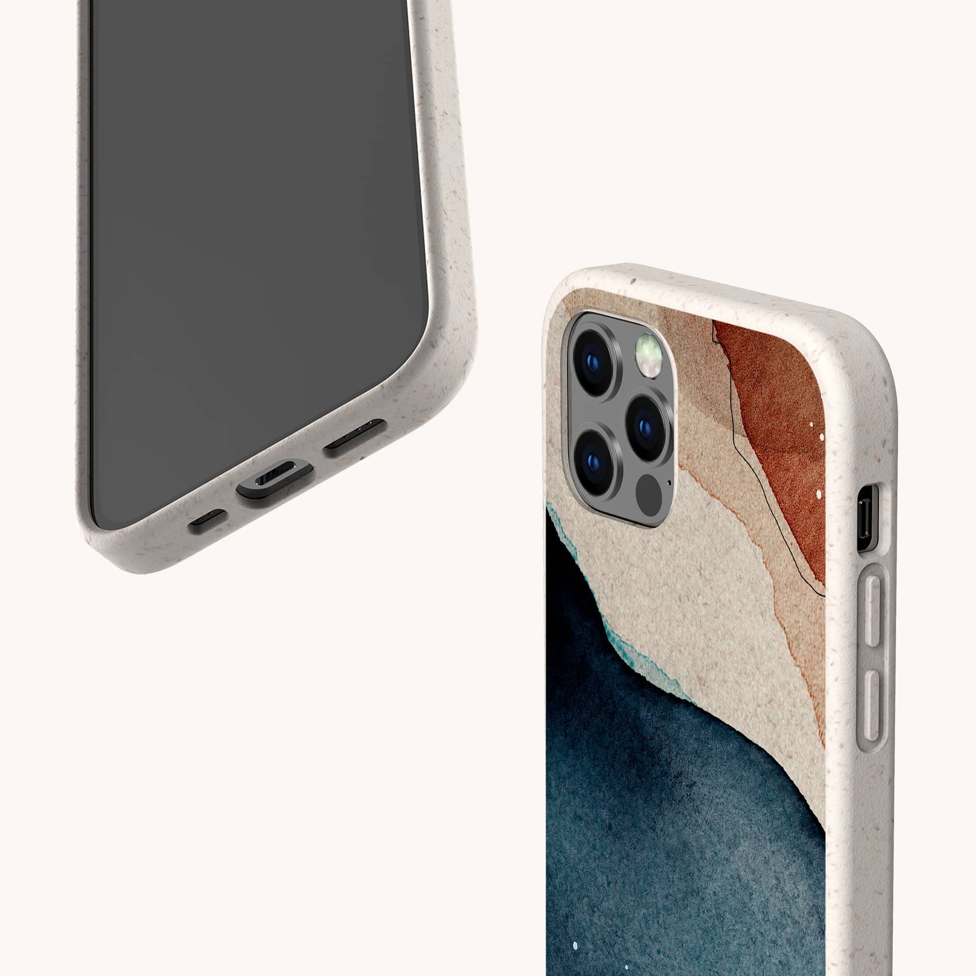 Two smartphones in beige Watercolour Landscape Eco-Friendly Phone Cases; one displays the screen and charging port, the other shows a blue, white, and brown abstract design by the camera. Both compostable cases are set against a light background.