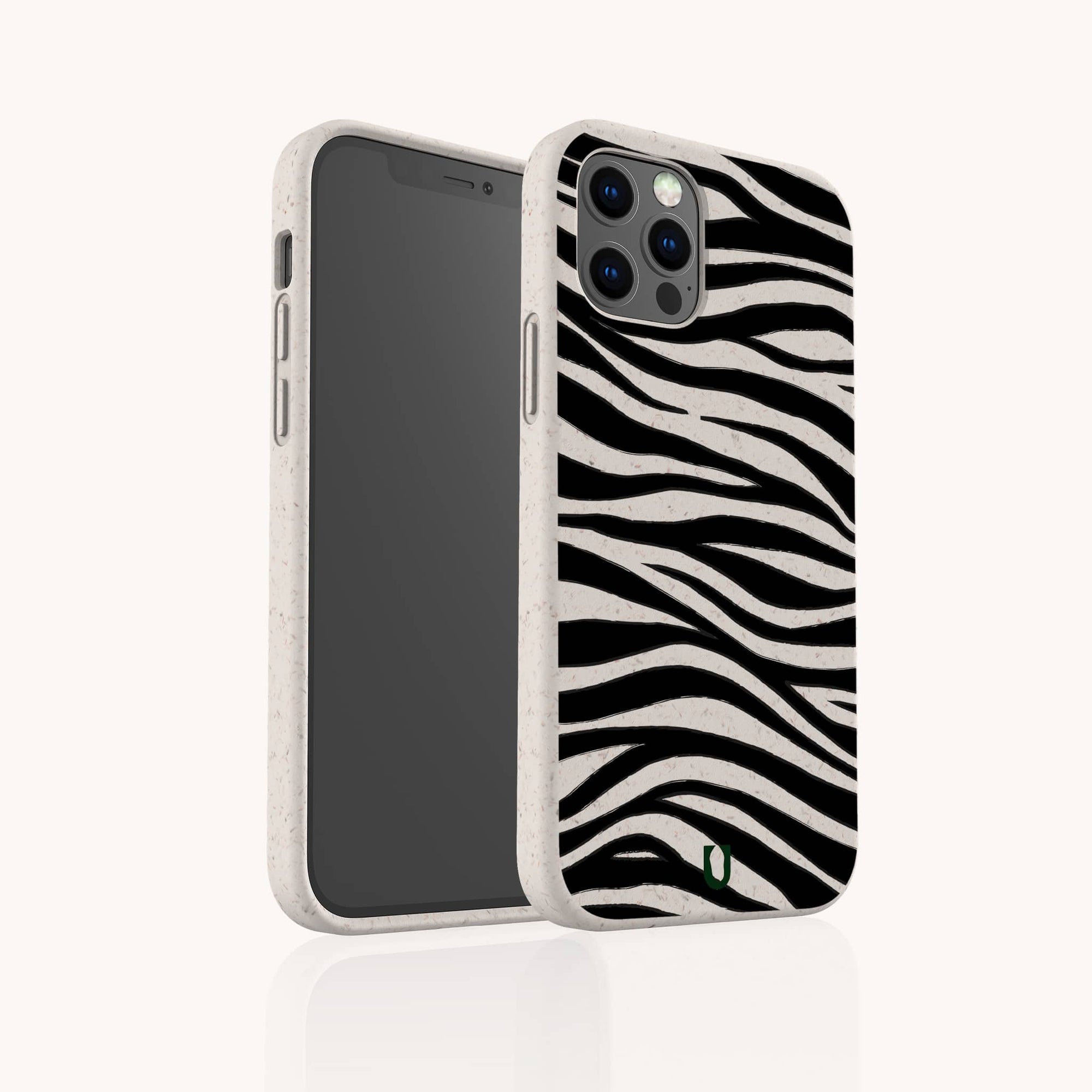 The Zebra Eco-Friendly Phone Case in beige features a black-and-white zebra stripe pattern, shown partly facing forward to highlight the rear design.