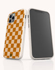 Two smartphones in beige cases with a brown checkerboard pattern on the back. One phone displays the distinctive Brown Checker Eco-Friendly Phone Case design, while the other shows the front screen. These eco-friendly cases combine stylish brown checkers with sustainable protection for your device.