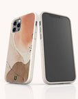 Two smartphones in abstract, earth-toned cases with marble patterns stand upright on a white background; one displays the back design while the other reveals the front screen. The Pink and Brown Watercolour Eco-Friendly Phone Case blends artistic flair with sustainability, offering elegant protection for your device.