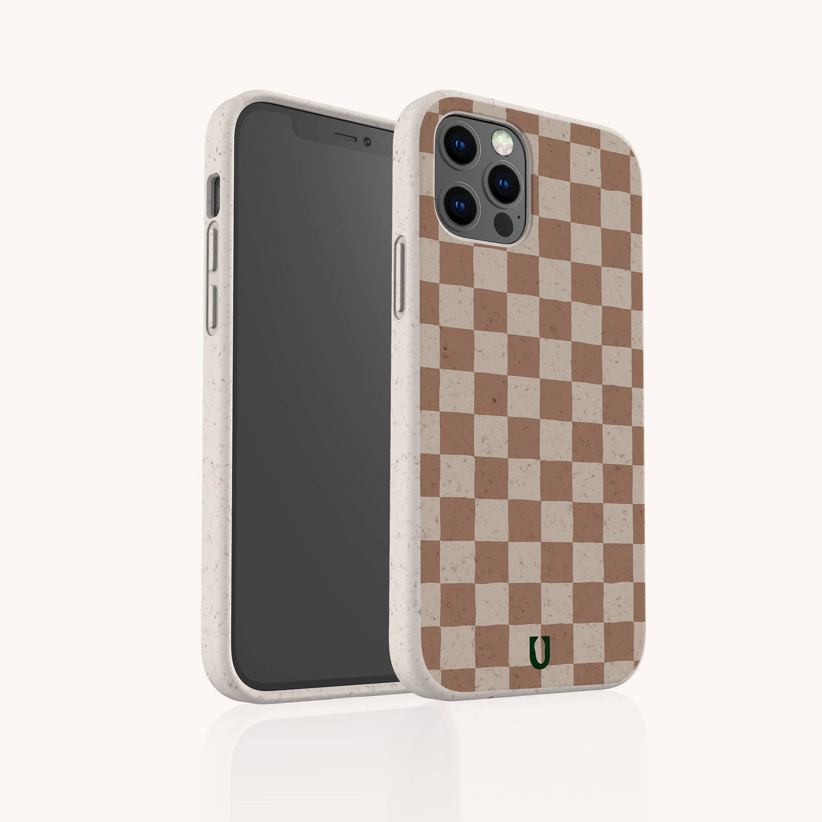 The Almond Checker Eco-Friendly Phone Case, featuring a beige and brown checkerboard pattern, is displayed standing upright on a plain white background. This classic design accentuates the camera and side buttons, seamlessly combining style with sustainability.