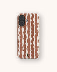 Cocoa Wave Stripe Eco-Friendly Biodegradable Phone Case with a pattern of vertical, wavy brown and cream stripes and a small U-shaped logo at the bottom.