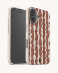 A smartphone featuring a Cocoa Wave Stripe Eco-Friendly Biodegradable Phone Case with a speckled, off-white and brown wavy striped design.