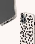 Little Black Flowers biodegradable phone case displayed on Samsung Galaxy S24 with elegant floral artwork and sustainable surface.