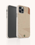 A smartphone with the Peachy Abstract Lines Biodegradable Phone Case, which is speckled beige and features a subtle geometric design along with a small green logo. This eco-friendly case includes cutouts for the camera and buttons, while the screen remains dark and reflects minimal light.