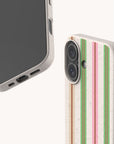 Pistachio Garden Stripe Eco-Friendly Biodegradable Phone Case with a speckled, light-colored base and vertical stripes in shades of green, pink, and brown.