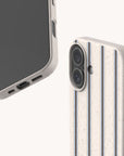 Two views of the Sailor Stripe Eco-Friendly Biodegradable Phone Case featuring a cream, blue, and dark brown vertical striped pattern with a speckled texture.